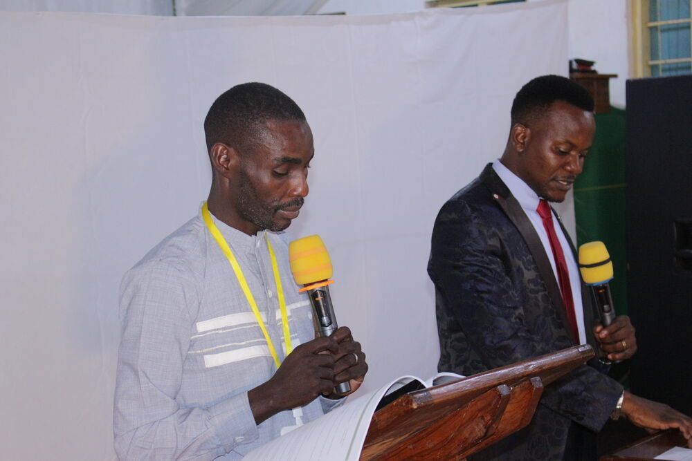 Leaders speaking at the podium, Kenya Disciple Makers Conference