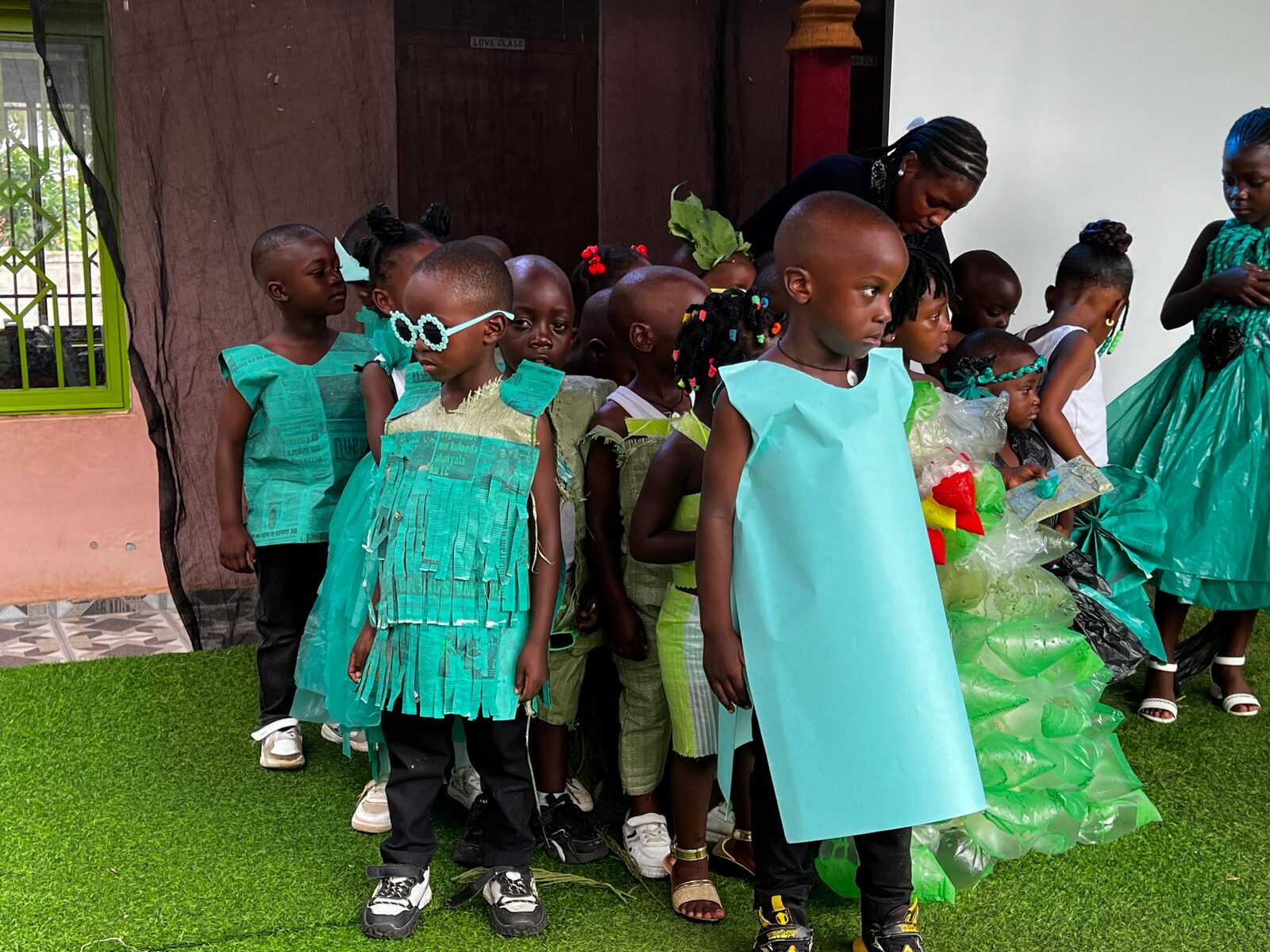 Close-up of a child's eco-fashion costume made from recycled paper and plastic